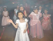 Young girls in dresses dancing