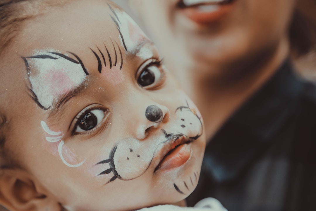 Face painting at a Purim party to entertain guests.