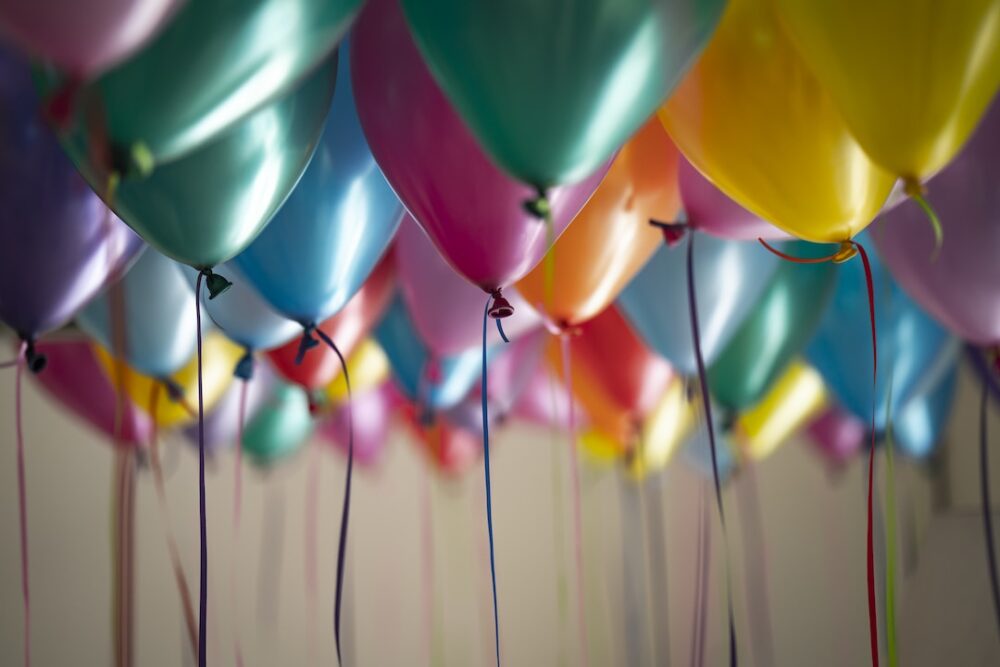 Dozens of balloons at a child's birthday party