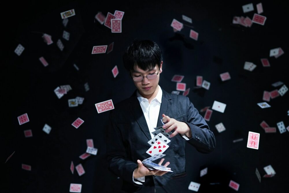 A magician practicing his card tricks